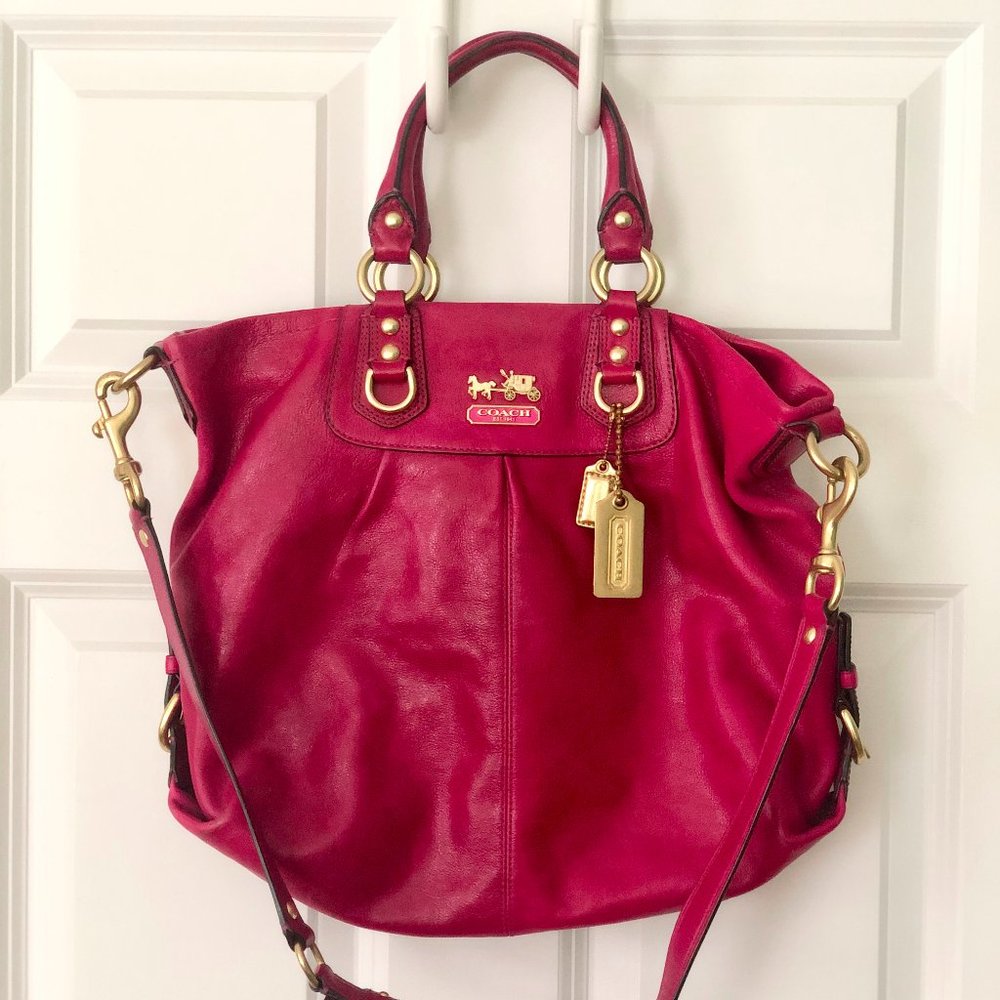 Magenta leather coach bag with gold accents